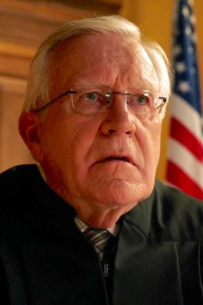 A headshot of Ken Camroux-Taylor.