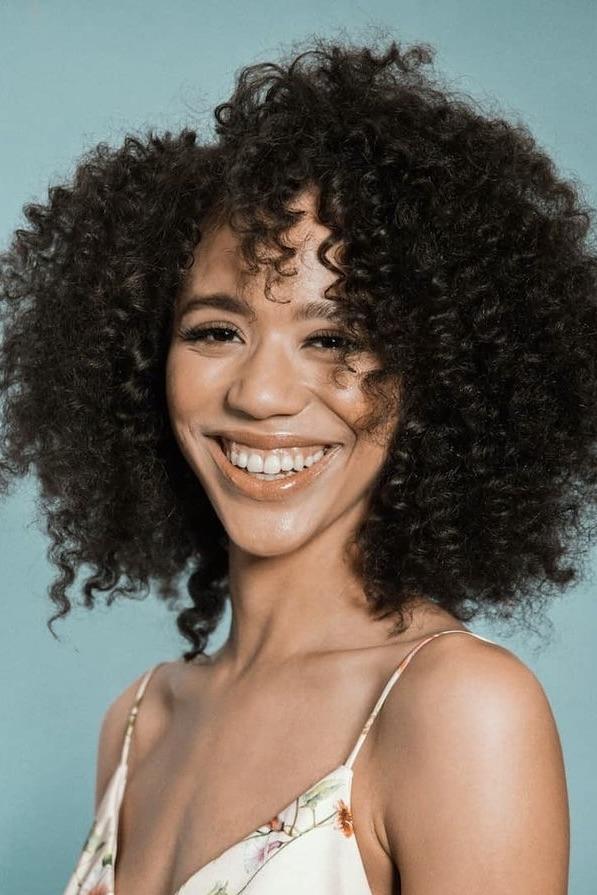 A headshot of Jasmin Savoy Brown.