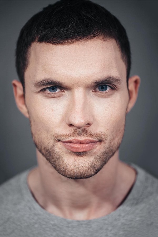 Official headshot photo of person: Ed Skrein.