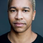 A headshot of Aaron Moten.