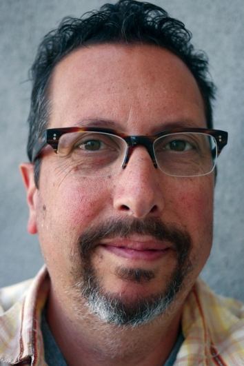 A headshot of John Shiban.