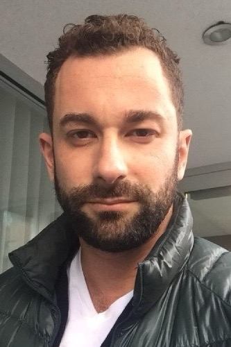 Official headshot photo of person: Ethan Tobman.